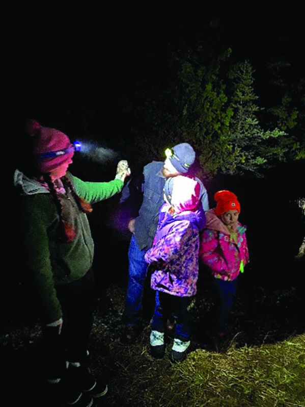 Kids attend an "owl camp" to learn about raptors and their migration