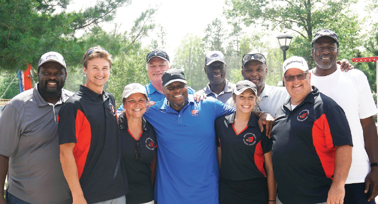 WP Superintendent Joe Perrera (front right) and his family pose with former Detroit Lions at a WPEF fundraiser