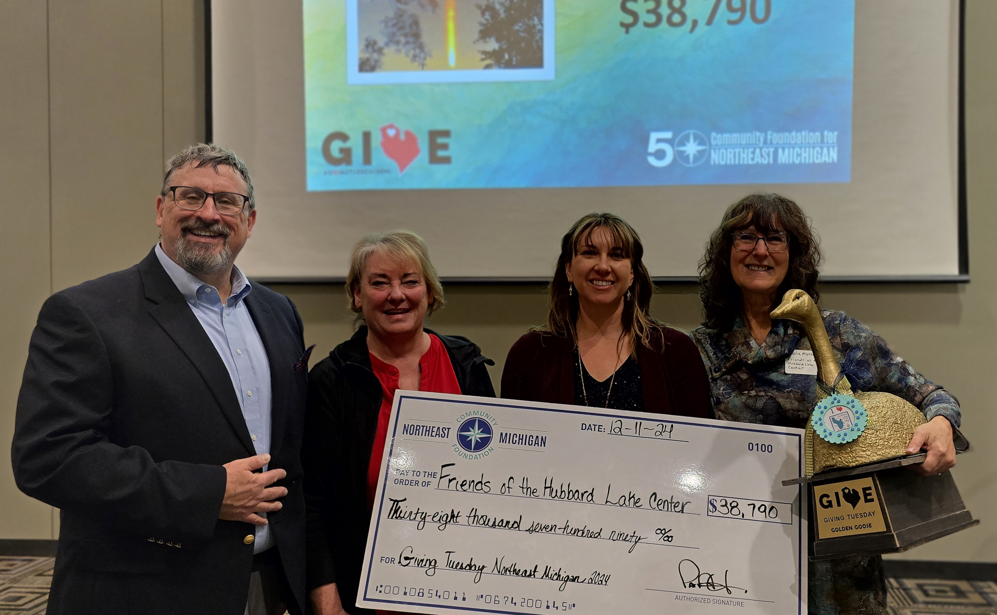 (Pictured here, CFNEM Executive Director Patrick Heraghty, Ann Gonsler, CFNEM Development/Marketing Director Christine Hitch, and Julie Mathewson. Ann and Julie attended to represent Friends of the Hubbard Lake Center.)